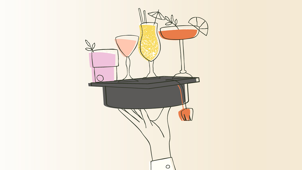 Mortarboard cap being used as a drinks tray for cocktails;