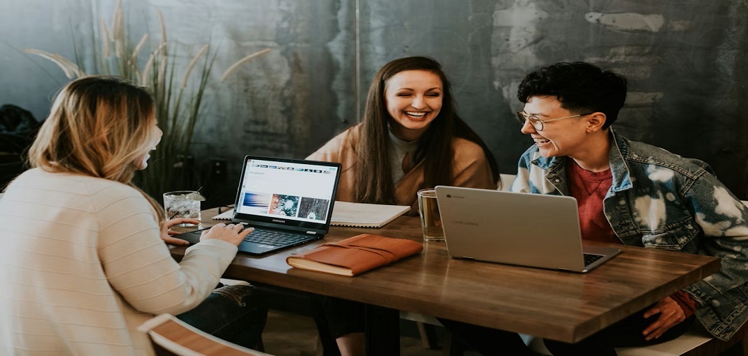 Photograph of a people laughing via unsplash.com